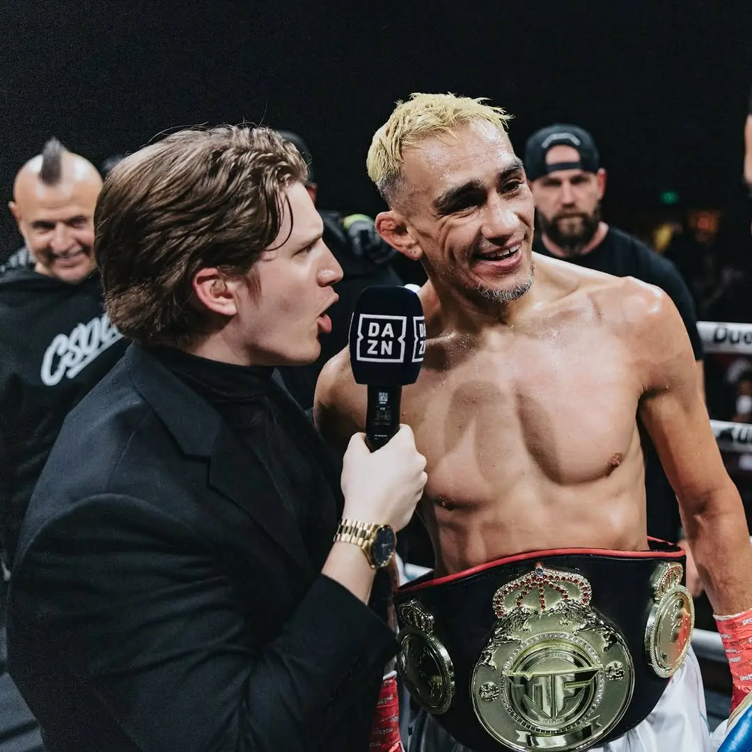 Ben Davis, play-by-play commentator, interviewing Tony Ferguson in the ring for DAZN